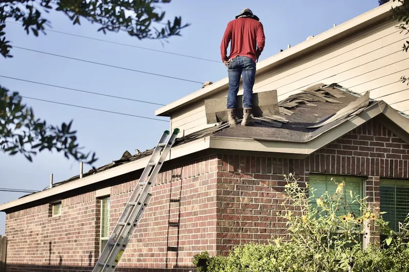 Professional roofer working on a residential roof in Lakemoor